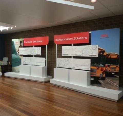 Multiple custom branded graphics for product display in showroom design and lobby by Holt Environments