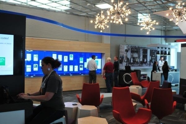 Workers at Inmar Innovations Lab in Winston Salem, NC, collaborate in newly branded custom interior design and graphics