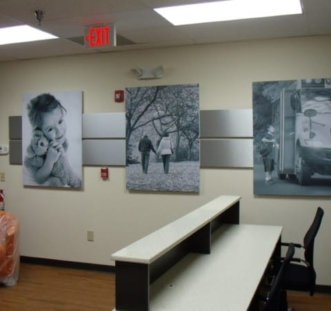 Monochrome high DPI prints of family mounted on aluminum panels on wall in Morrisville, NC
