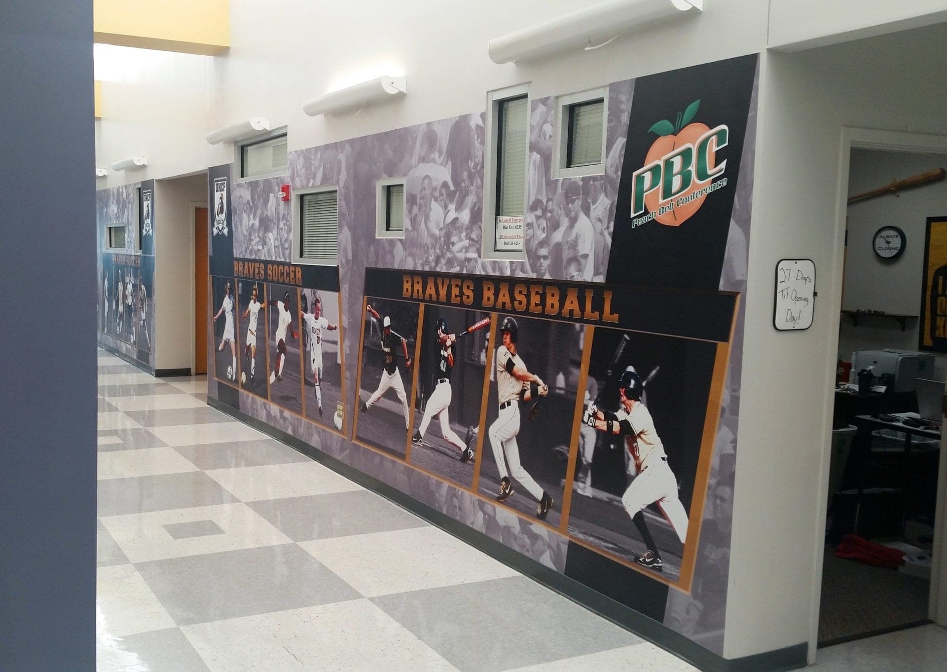 Custom high resolution graphics for college sports commercial interior design by Holt Environments