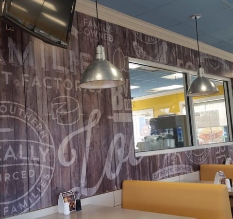 Biscuitville rebranded corporate interior with custom high resolution vinyl wall graphics and restaurant furnishing