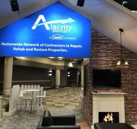 Flexible corporate event space at Holt Experiential with digital signage and modern decor.