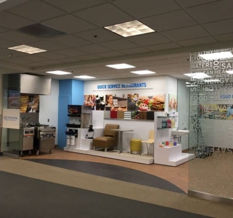 Ecolab Tour Stop custom interior with fabricated risers, kiosks, product displays, wall graphics and glass vinyl lettering