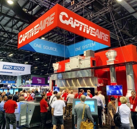 People gather at CaptiveAire NAFEM custom trade show exhibit designed and fabricated by Holt Environments