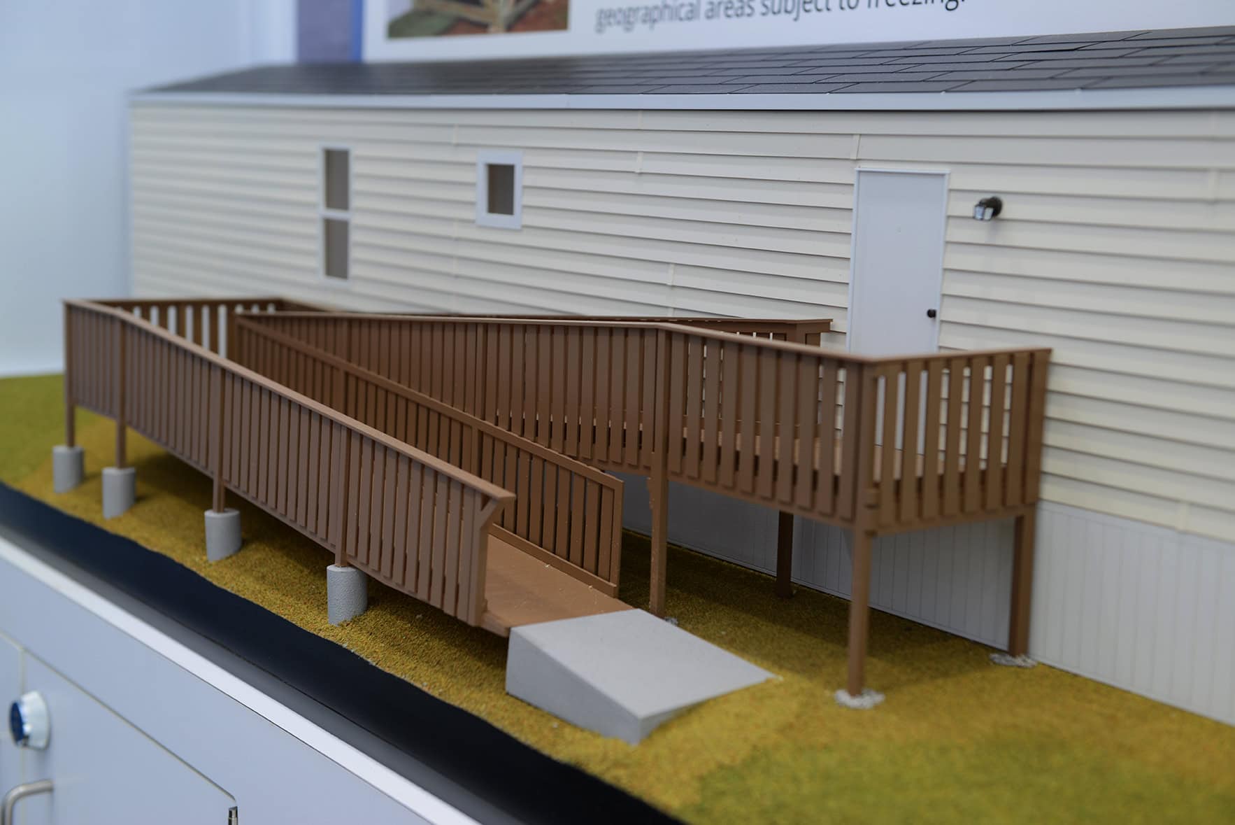 Miniature model of manufactured home as part of mobile contractor training trailer