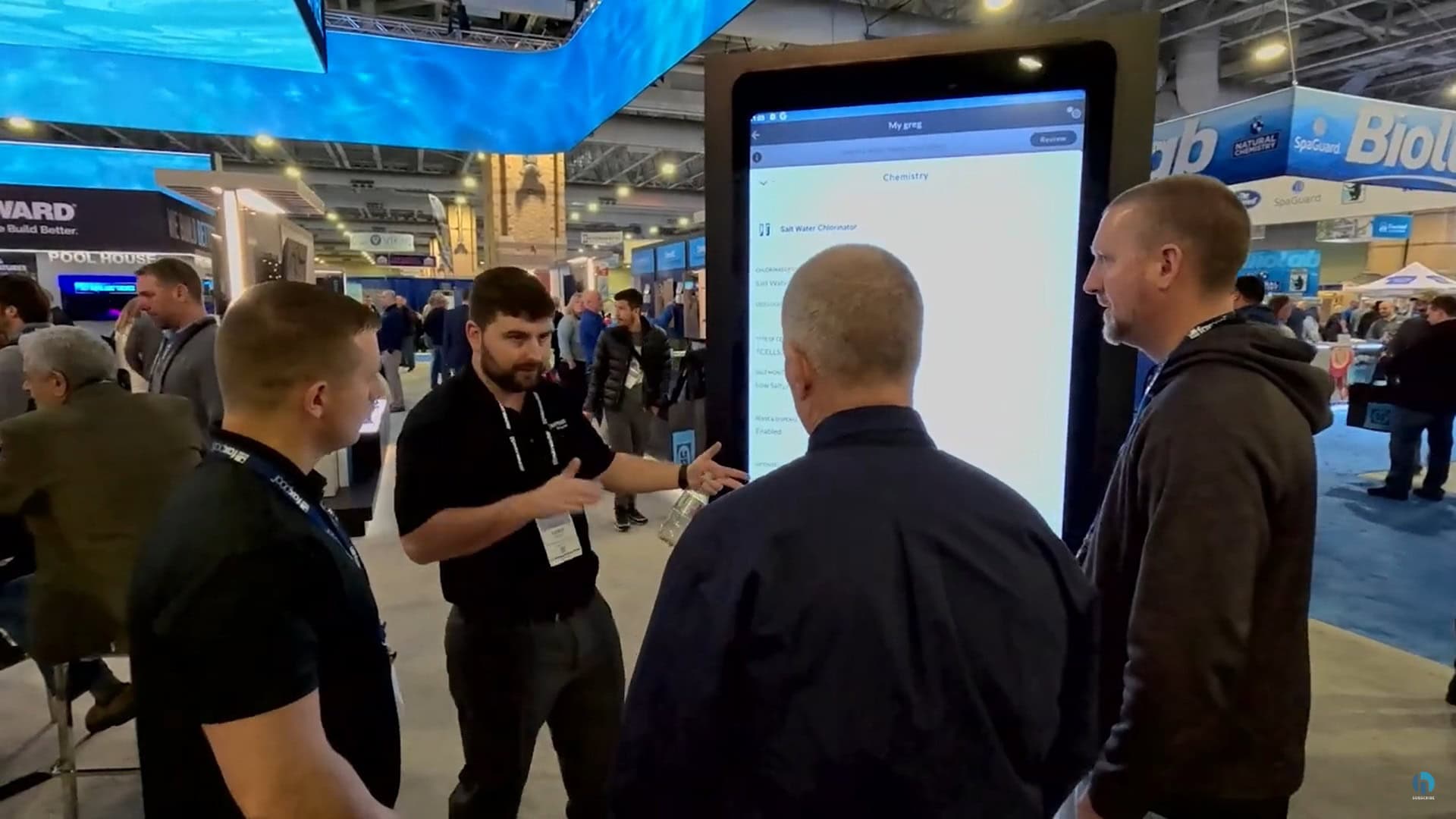 smart phone app demo on large touch screen in trade show exhibit - Hayward Pools