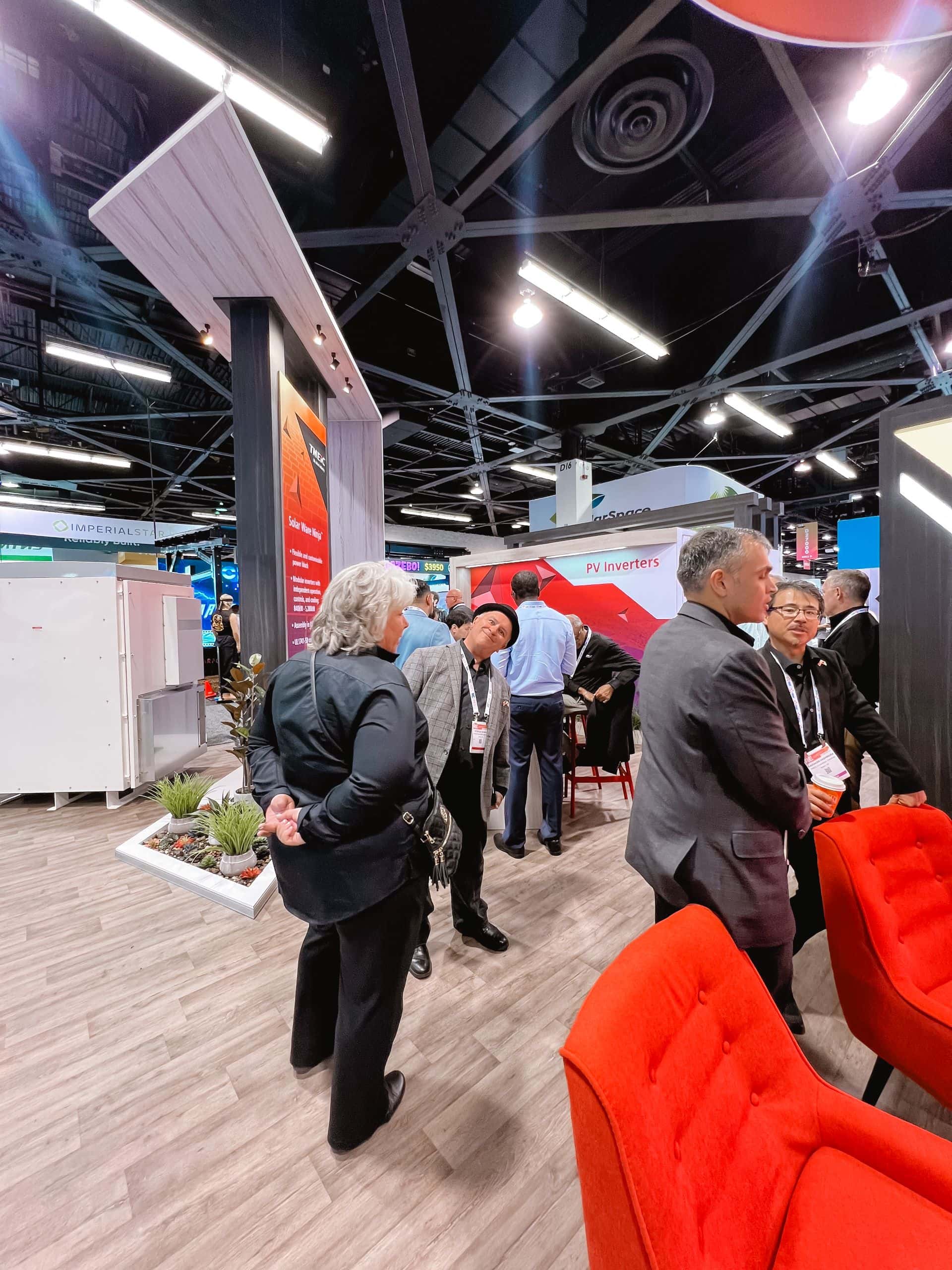 TMEIC 30x50 island trade show exhibit at RE+ 2024 - busy booth