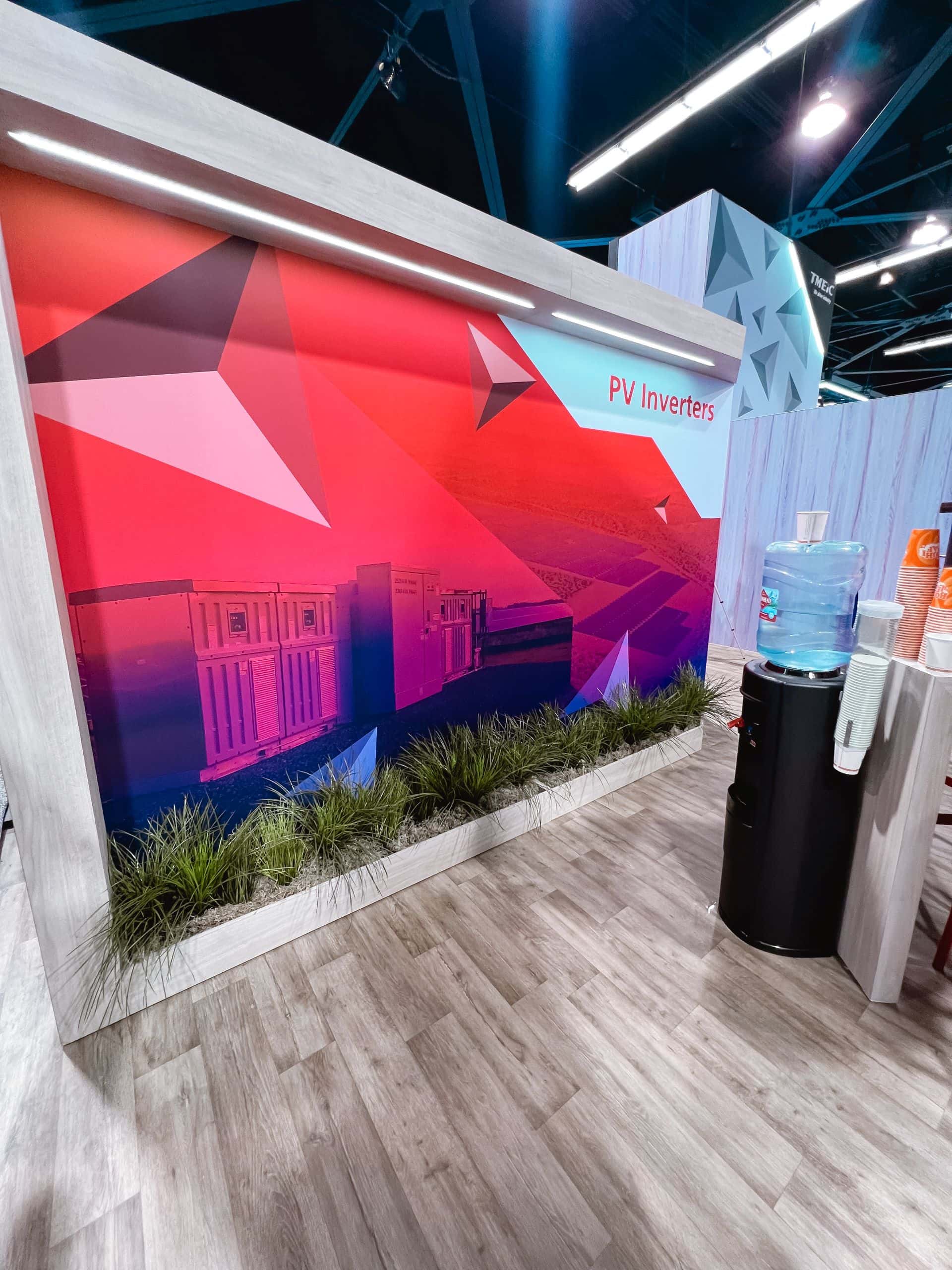 TMEIC 30x50 island trade show exhibit at RE+ 2024 - mural wall