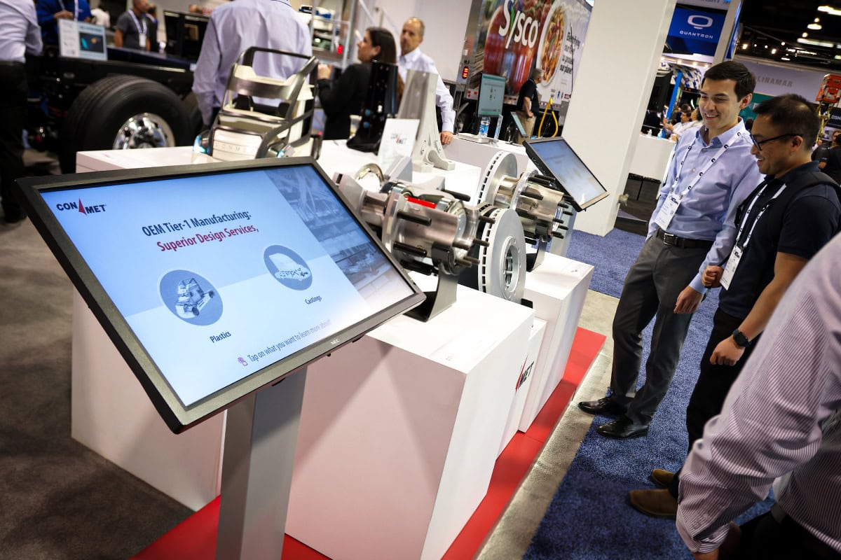 Conmet product demonstration in trade show exhibit