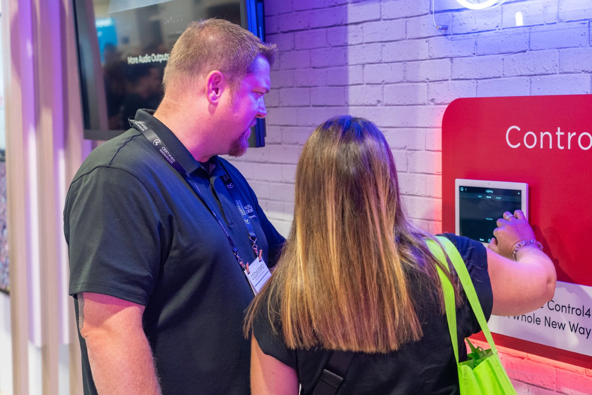 Snap One 50x70 trade show exhibit CEDIA 2024 - touching Control 4