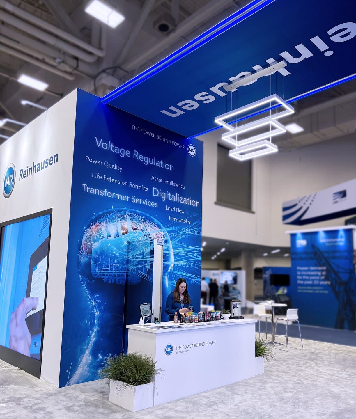 Reinhausen trade show exhibit Dtech 2025 - reception desk bride