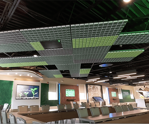 Wide shot of completed Coastal AgroBusiness Innovation Center with digital screens, custom furnishings, branding, and ceiling design by Holt Experiential.