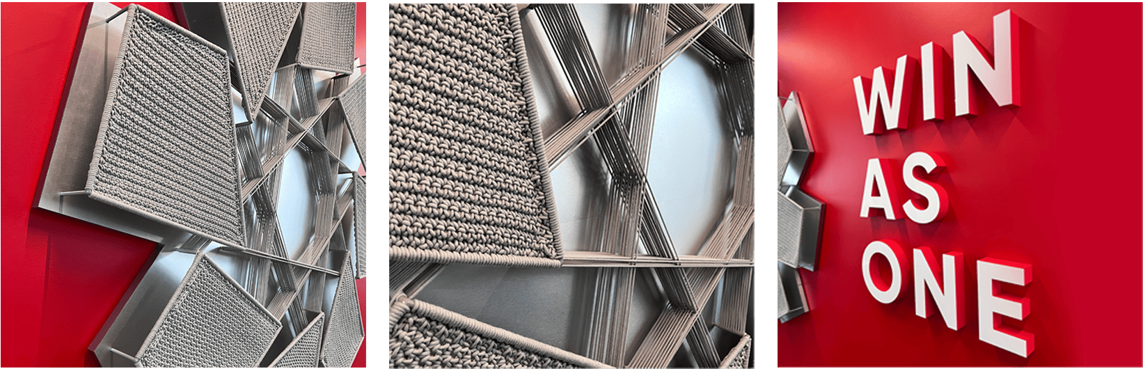 Detailed view of the &lsquo;WIN AS ONE&rsquo; 3D image board, featuring extruded letters and a metal diagram structure. The design highlights depth and texture, emphasizing teamwork, brand identity, and the creative craftsmanship of Holt Experiential.