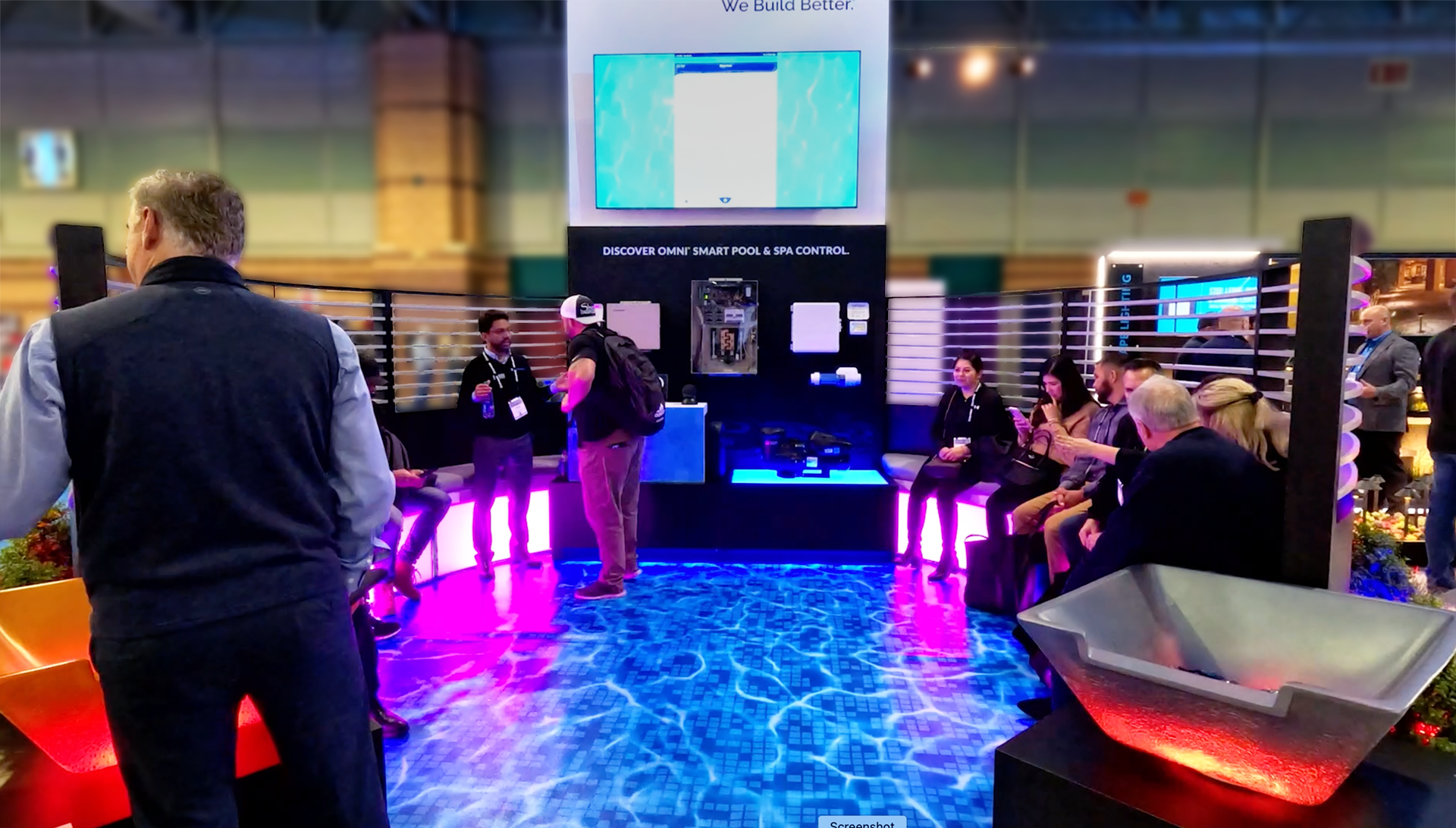 Branded feature tower with electronic demonstration screen showcasing Hayward&rsquo;s Omni Logic pool controls and smart lighting, designed by Holt Experiential for the award-winning trade show exhibit.