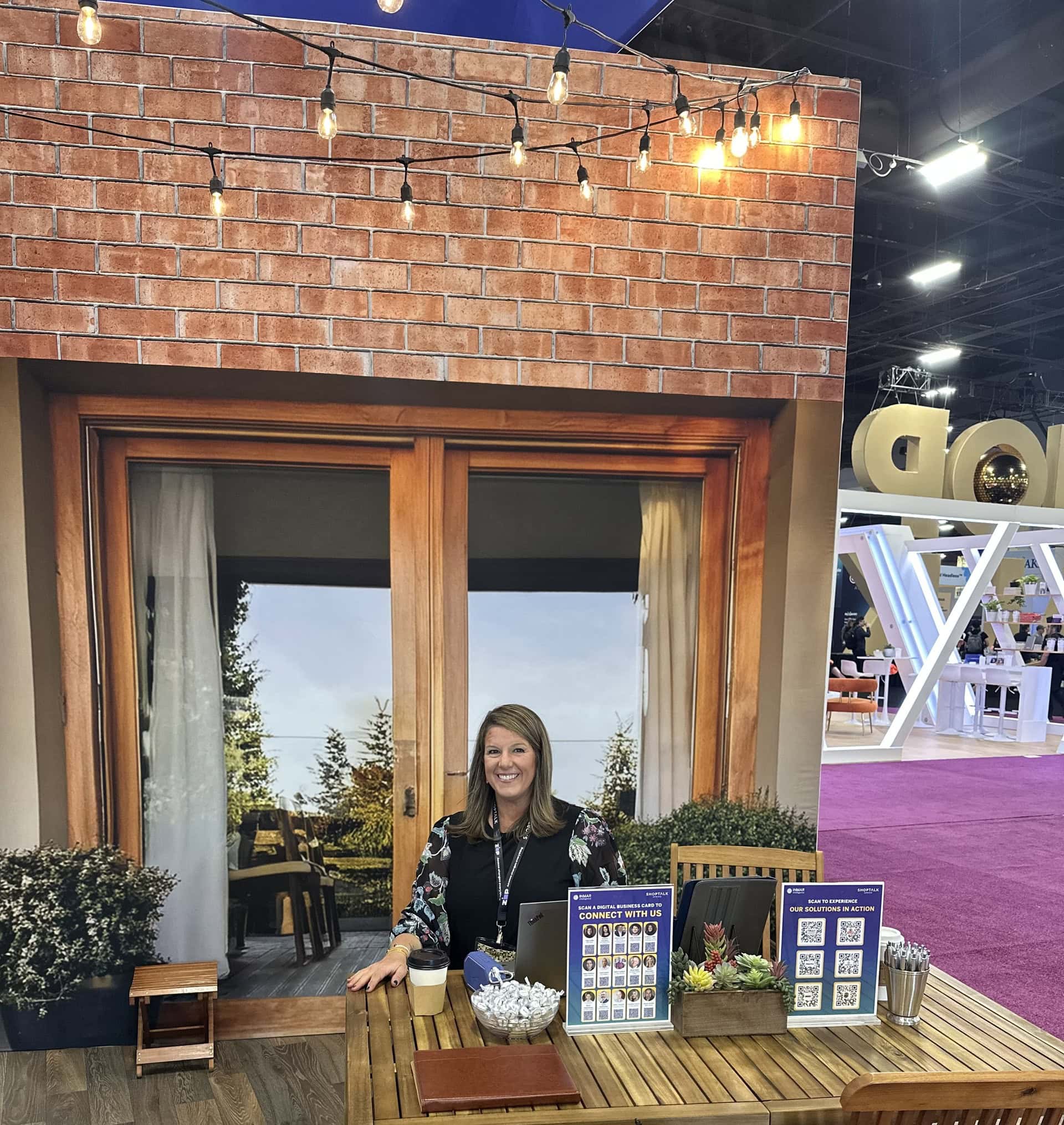 Inmar Media 20x20 exhibit at Shoptalk Spring 2025 - host at patio vignette