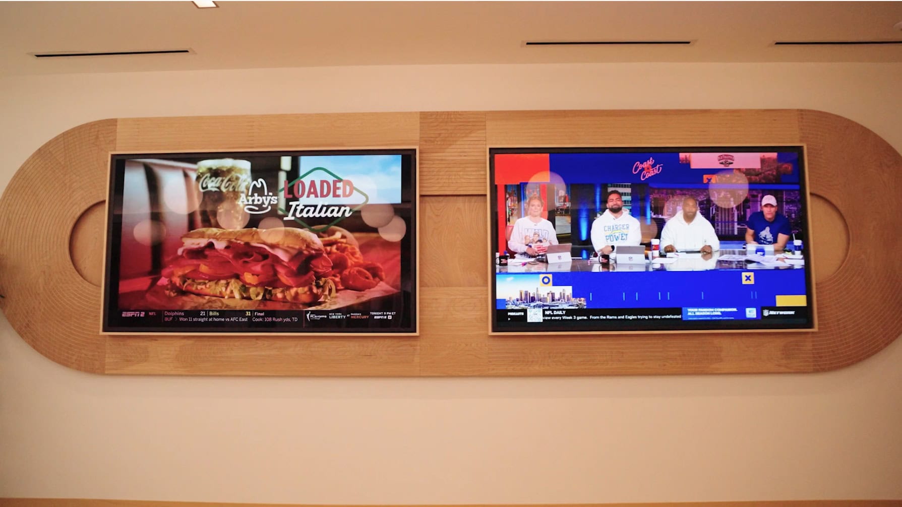 Syngenta - Cafe Wall large monitors with custom millwork and live tvs