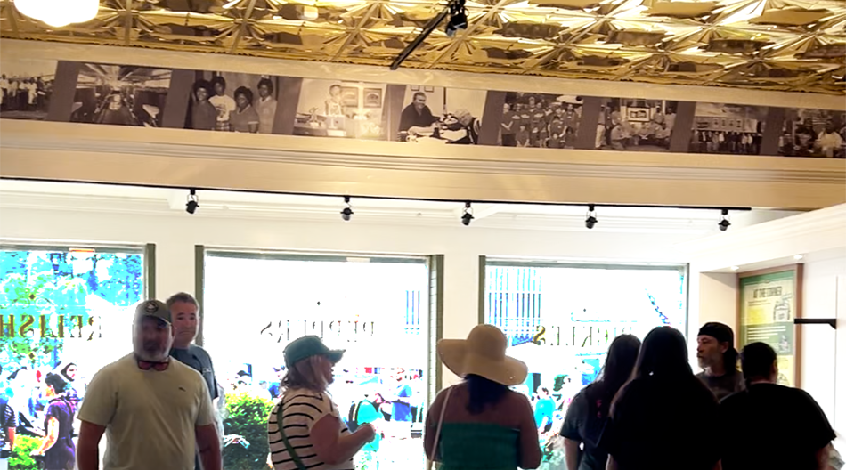 Mount Olive Pickle history timeline displayed above visitors inside the Pickle Parlor.