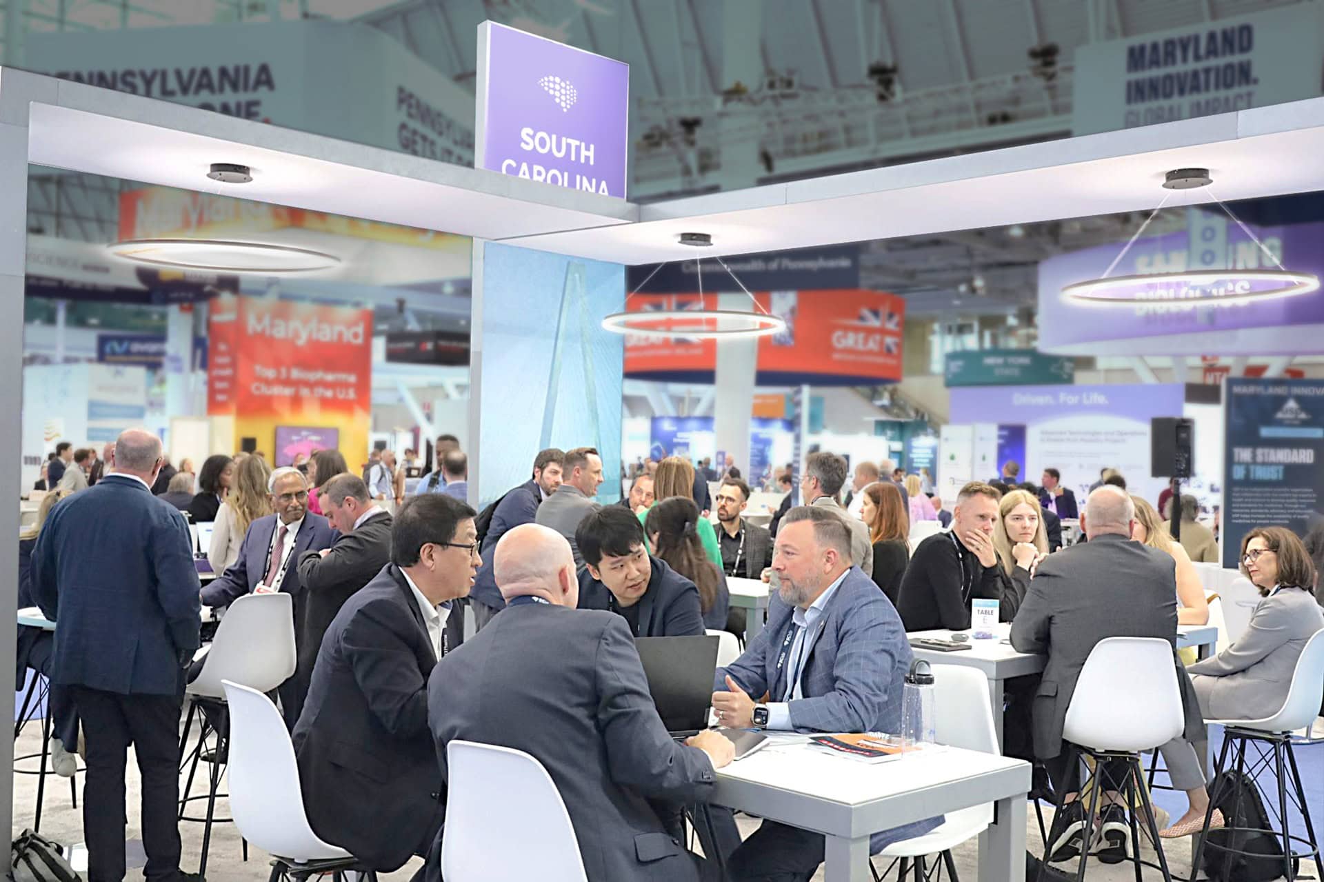SCbio 20x50 trade show exhibit BIO 2025 - crowds of meetings